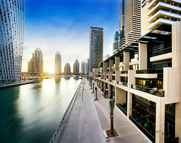 skyline of Dubai Marina at night with boats, United Arab Emirates, Middle East